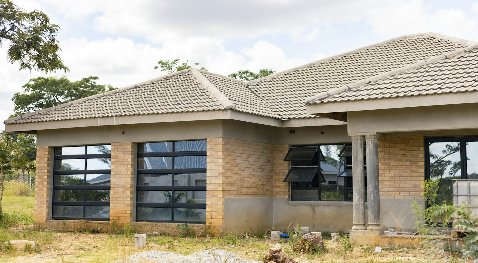 Single-story brick house with a tiled roof